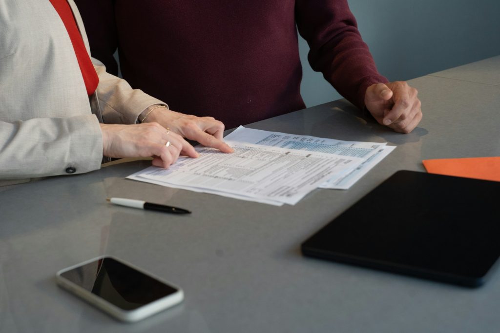 Finance professionals reviewing application documents